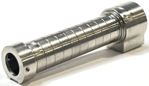 Stator housing holds both bearings in line, keeping lathe bore diameter and straightness variance to within 1 to 2 microns.